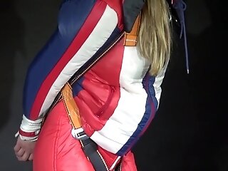 Watching Sexy Sandra Wearing A Sexy Oldschool Downbib And A Down Jacket Being Suspended, Tied, Gagged And Hooded With Ropes And A Ballgag (Video)